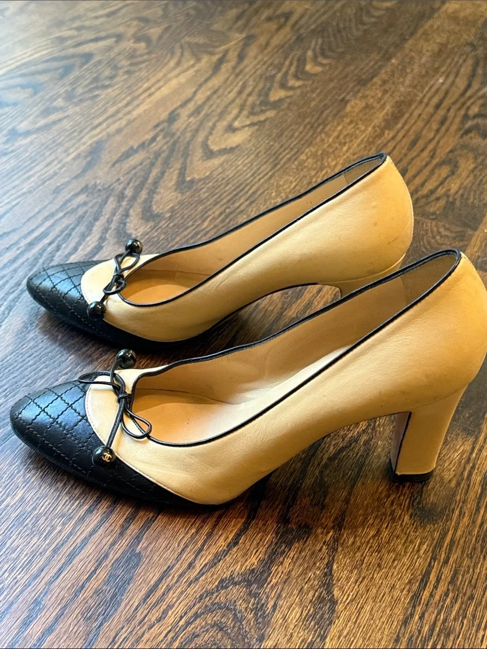 CHANEL Beige and Black Quilted Cap-Toe Bow Pumps size 39